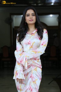 actress ashika ranganath in a white floral dress