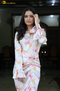 actress ashika ranganath in a white floral dress