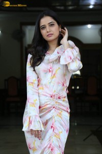 actress ashika ranganath in a white floral dress