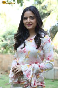 actress ashika ranganath in a white floral dress