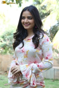 actress ashika ranganath in a white floral dress