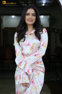 actress ashika ranganath in a white floral dress