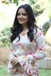actress ashika ranganath in a white floral dress