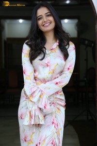 actress ashika ranganath in a white floral dress