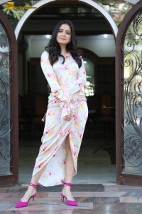 actress ashika ranganath in a white floral dress