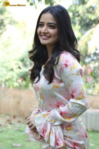 actress ashika ranganath in a white floral dress