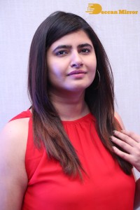 Ashima Narwal in a Red Dress