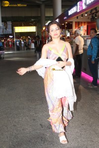 actress Avneet Kaur in a colorful dress at mumbai airport