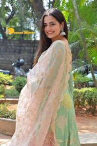 Actress Ayesha Khan in a green salwar