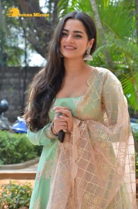 Actress Ayesha Khan in a green salwar