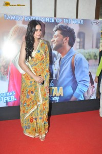 actress Ayesha Khan in a yellow saree attending a movie event