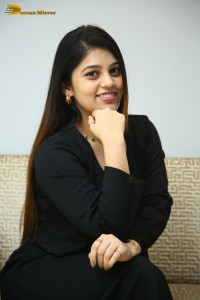 Actress Bandhavi Sridhar in a black dress