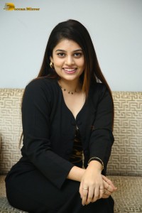 Actress Bandhavi Sridhar in a black dress