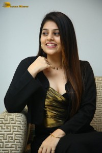 Actress Bandhavi Sridhar in a black dress