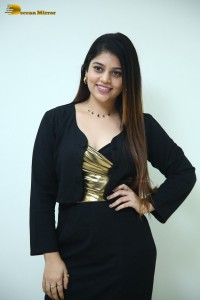 Actress Bandhavi Sridhar in a black dress