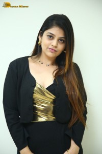 Actress Bandhavi Sridhar in a black dress