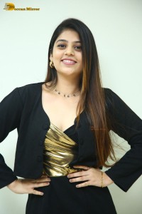 Actress Bandhavi Sridhar in a black dress