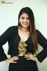 Actress Bandhavi Sridhar in a black dress
