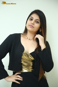 Actress Bandhavi Sridhar in a black dress