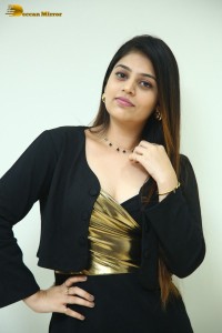 Actress Bandhavi Sridhar in a black dress