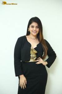 Actress Bandhavi Sridhar in a black dress