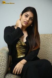 Actress Bandhavi Sridhar in a black dress