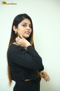 Actress Bandhavi Sridhar in a black dress