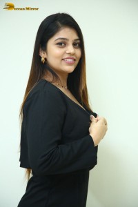 Actress Bandhavi Sridhar in a black dress