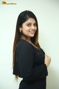 Actress Bandhavi Sridhar in a black dress