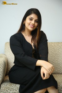 Actress Bandhavi Sridhar in a black dress