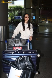 actress Banita Sandhu cute in a white top and denim jeans