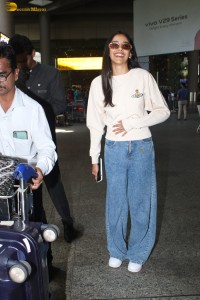 actress Banita Sandhu cute in a white top and denim jeans