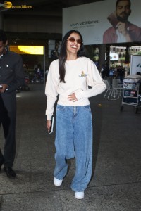 actress Banita Sandhu cute in a white top and denim jeans