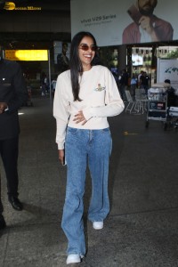 actress Banita Sandhu cute in a white top and denim jeans