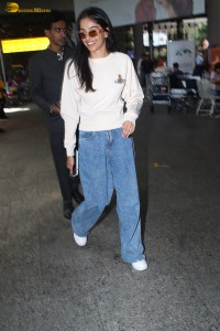 actress Banita Sandhu cute in a white top and denim jeans