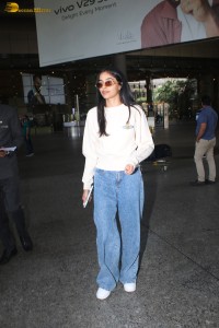 actress Banita Sandhu cute in a white top and denim jeans
