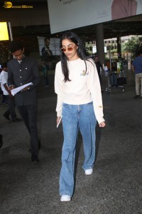 actress Banita Sandhu cute in a white top and denim jeans