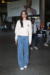 actress Banita Sandhu cute in a white top and denim jeans