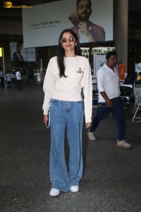 actress Banita Sandhu cute in a white top and denim jeans