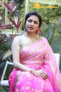 Indian Actress Bhagyashree posing in a Pink Saree