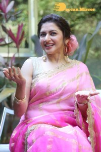 Indian Actress Bhagyashree posing in a Pink Saree