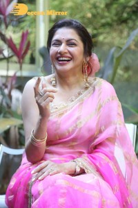 Indian Actress Bhagyashree posing in a Pink Saree
