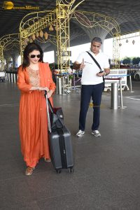 Maine Pyar Kiya actress bhagyashree gorgeous in a orange dress at mumbai airport