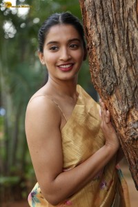 actress Bhavana Vazhapandal ravishing looks in a gold color saree