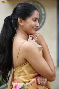 actress Bhavana Vazhapandal ravishing looks in a gold color saree