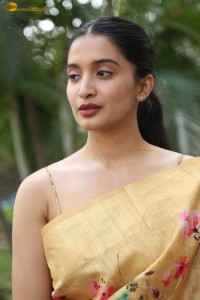 actress Bhavana Vazhapandal ravishing looks in a gold color saree