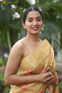 actress Bhavana Vazhapandal ravishing looks in a gold color saree