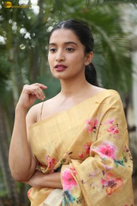 actress Bhavana Vazhapandal ravishing looks in a gold color saree