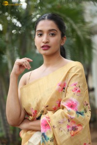 actress Bhavana Vazhapandal ravishing looks in a gold color saree