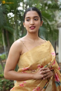 actress Bhavana Vazhapandal ravishing looks in a gold color saree